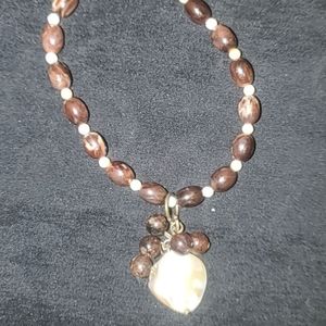 Beaded gemstone bracelet with pearl coin pendant